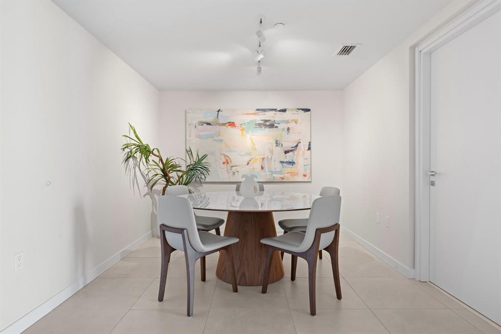 401 North Birch Road, Unit 1102 Fort Lauderdale, FL 33304 - Photo 8 of 31 a view of a dining room with furniture