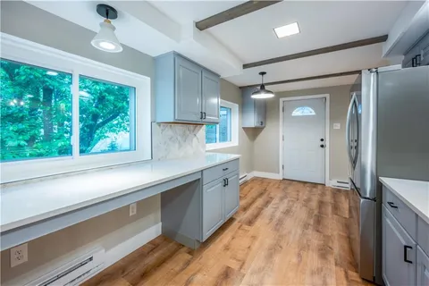 a living room with a table and chairs