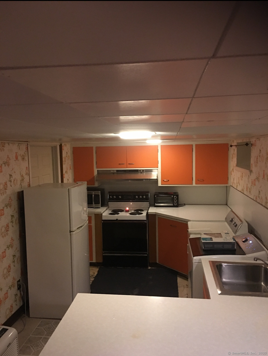 39 Alice Drive Manchester, CT 06042 - Photo 15 of 15 a kitchen with a refrigerator and a stove