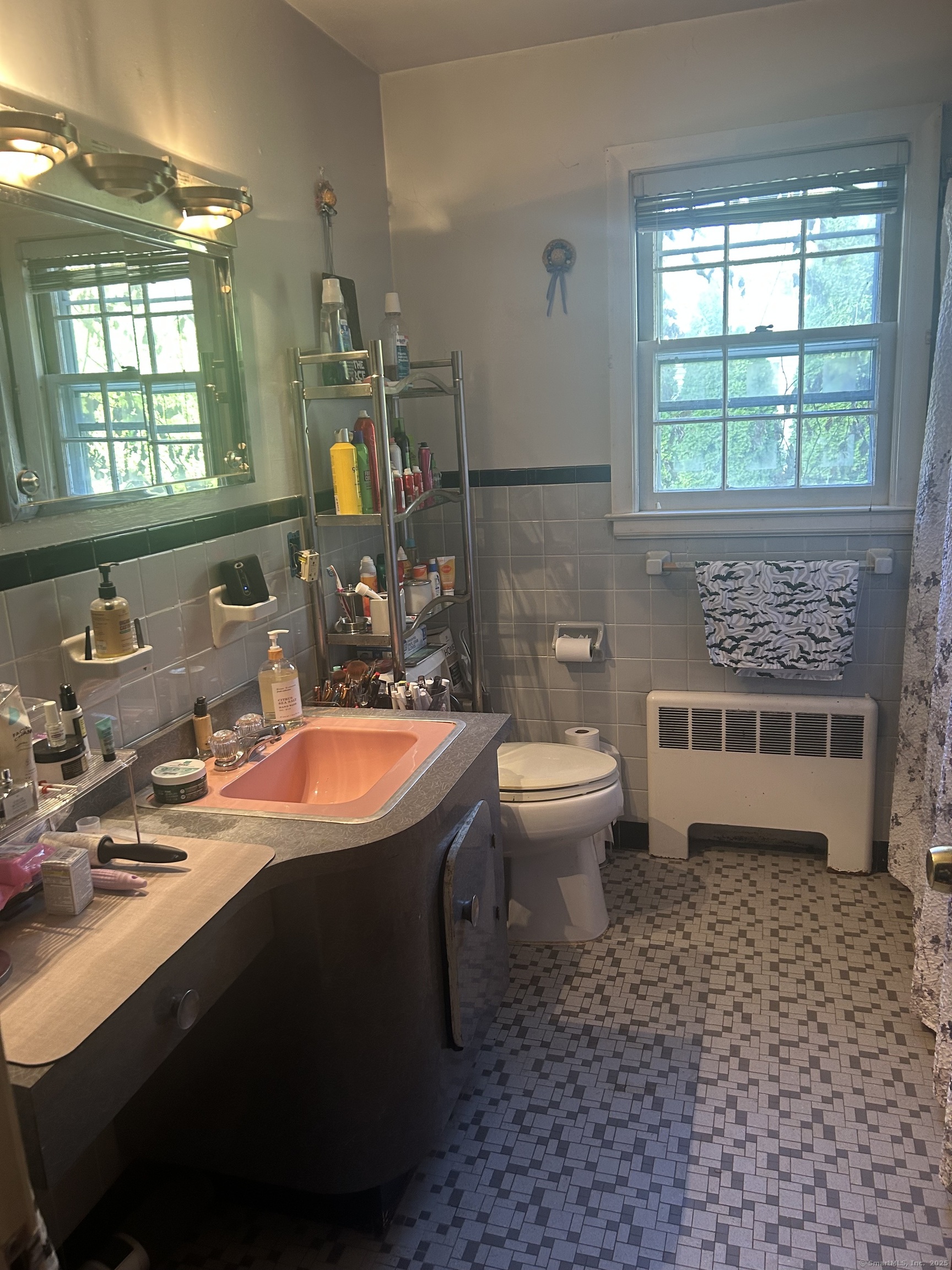 39 Alice Drive Manchester, CT 06042 - Photo 9 of 15 a bathroom with a sink toilet and mirror