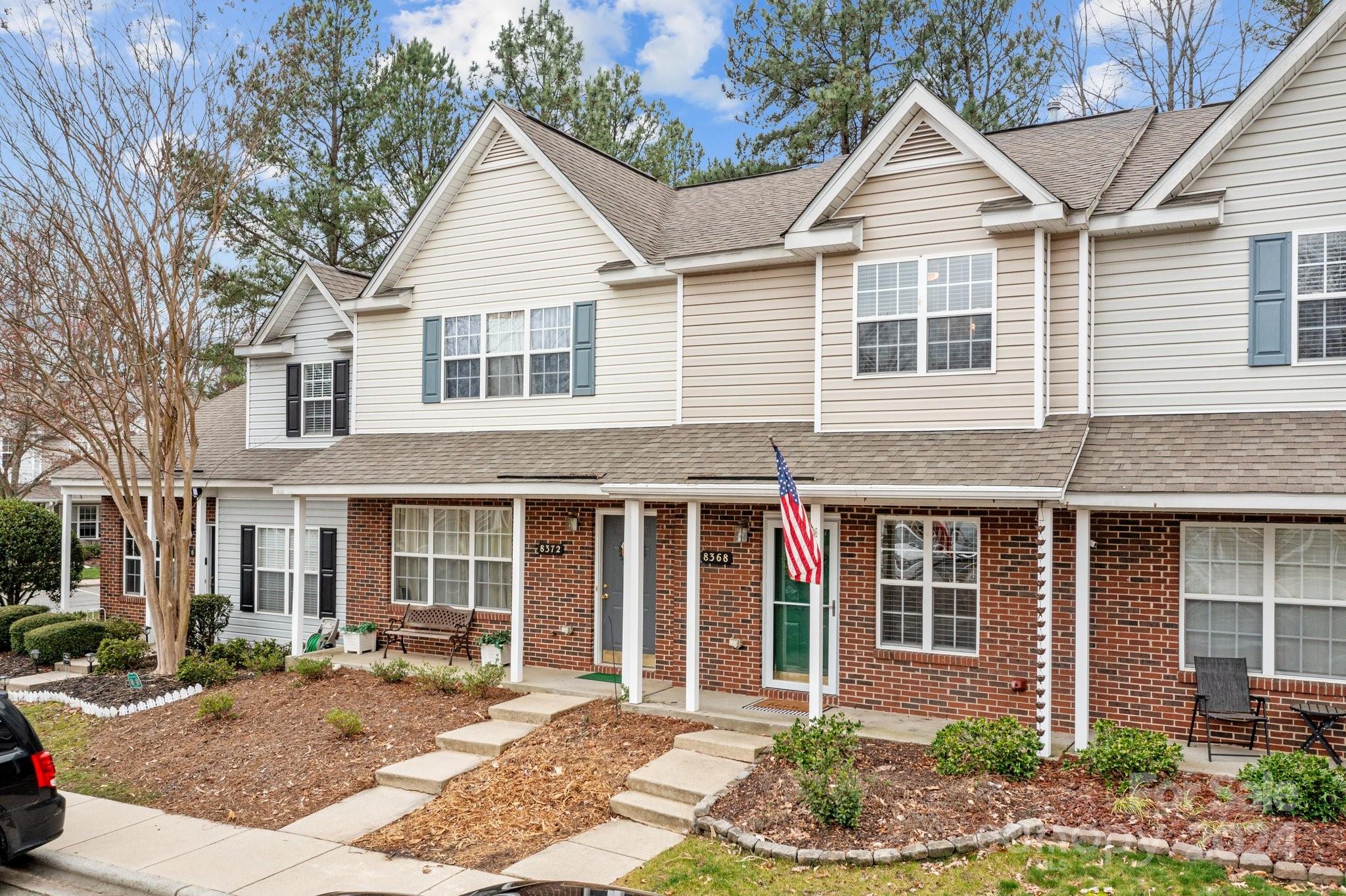 8368 Rudolph Road Charlotte, NC 28216 - Photo 2 of 43 a front view of a house with a yard