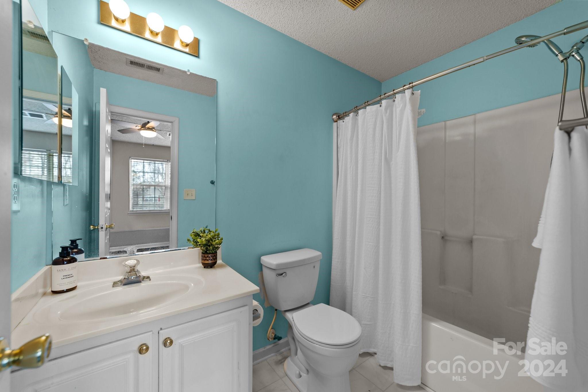 8368 Rudolph Road Charlotte, NC 28216 - Photo 27 of 43 a bathroom with a sink toilet and shower