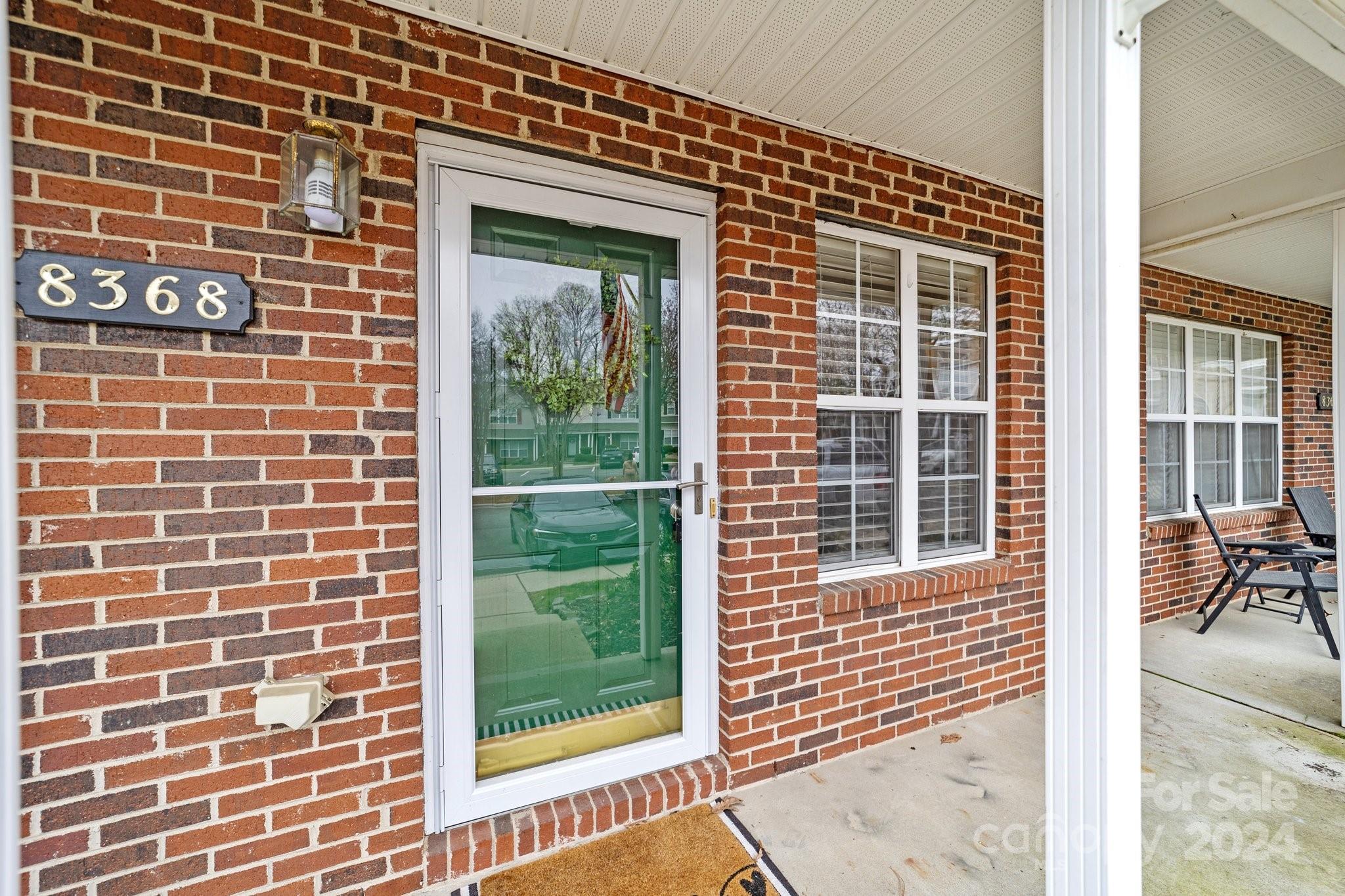 8368 Rudolph Road Charlotte, NC 28216 - Photo 3 of 43 a view of a brick wall with a large window