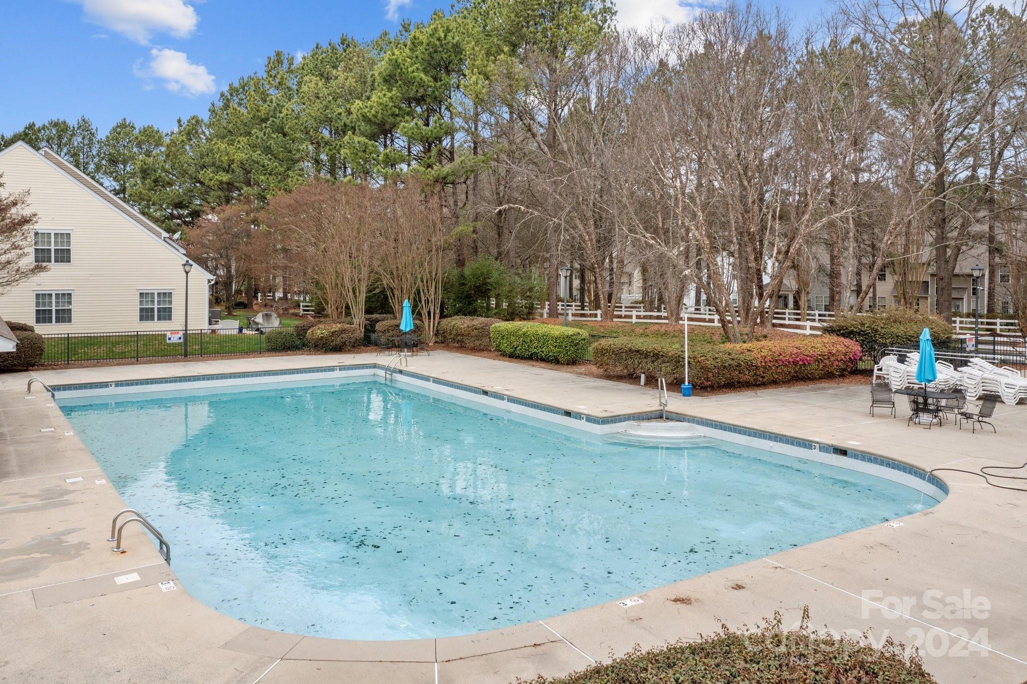 8368 Rudolph Road Charlotte, NC 28216 - Photo 34 of 43 a view of a swimming pool with an outdoor seating