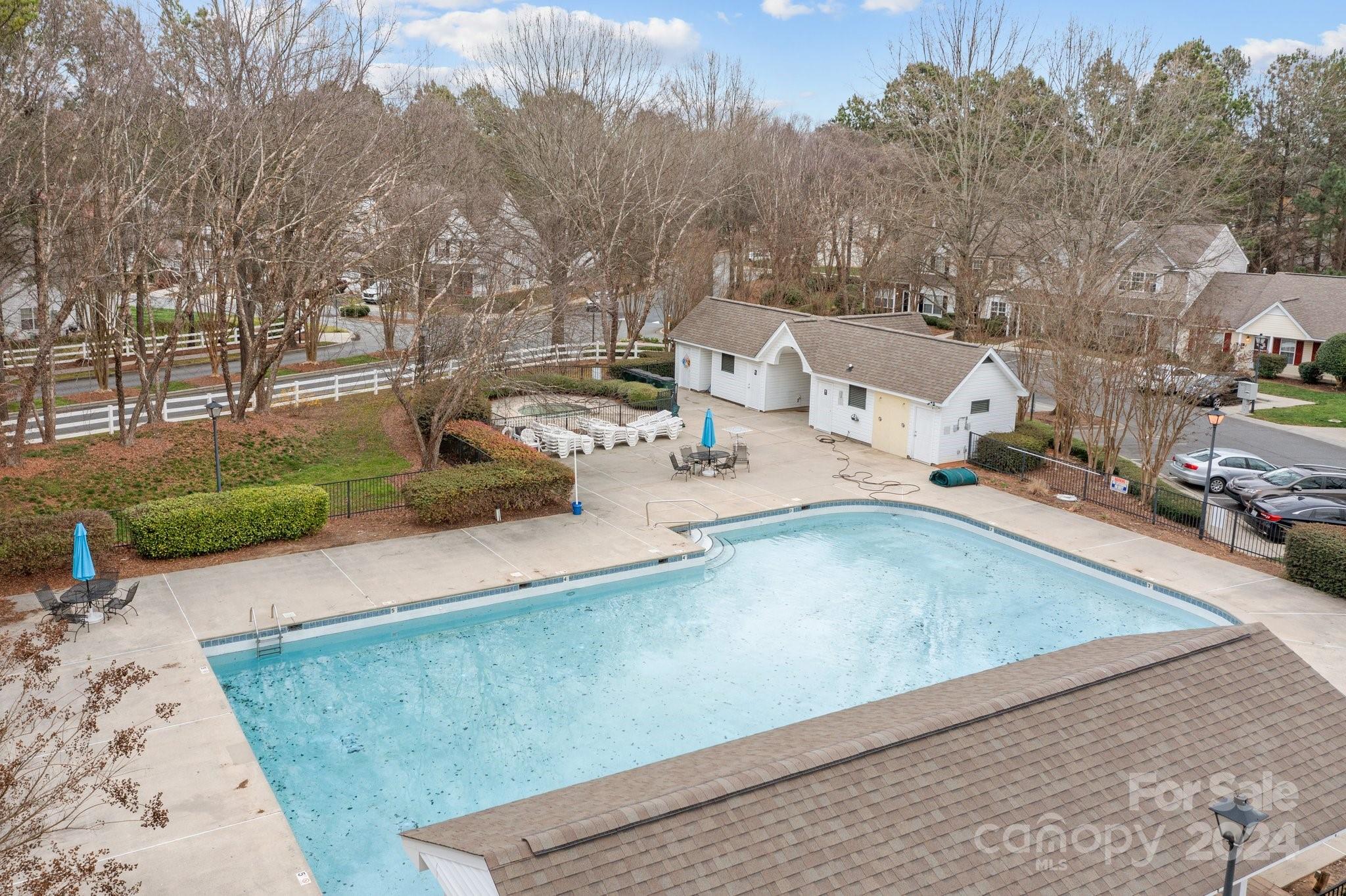 8368 Rudolph Road Charlotte, NC 28216 - Photo 35 of 43 a view of a backyard patio and fire pit