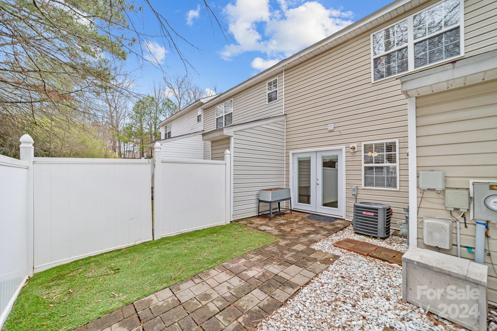 8368 Rudolph Road Charlotte, NC 28216 - Photo 5 of 43 a backyard of a house with yard and outdoor seating