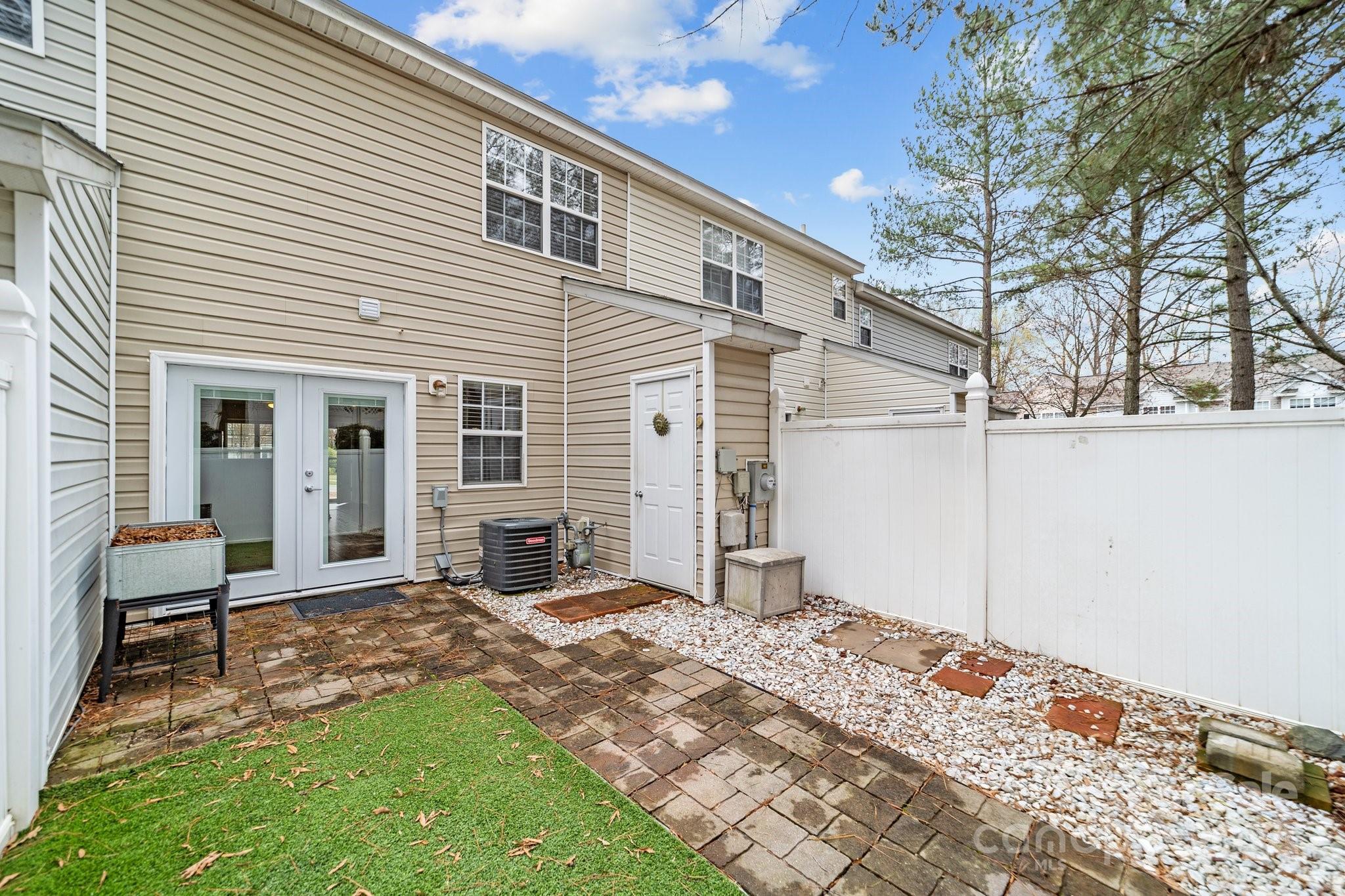 8368 Rudolph Road Charlotte, NC 28216 - Photo 6 of 43 a front view of a house with a yard