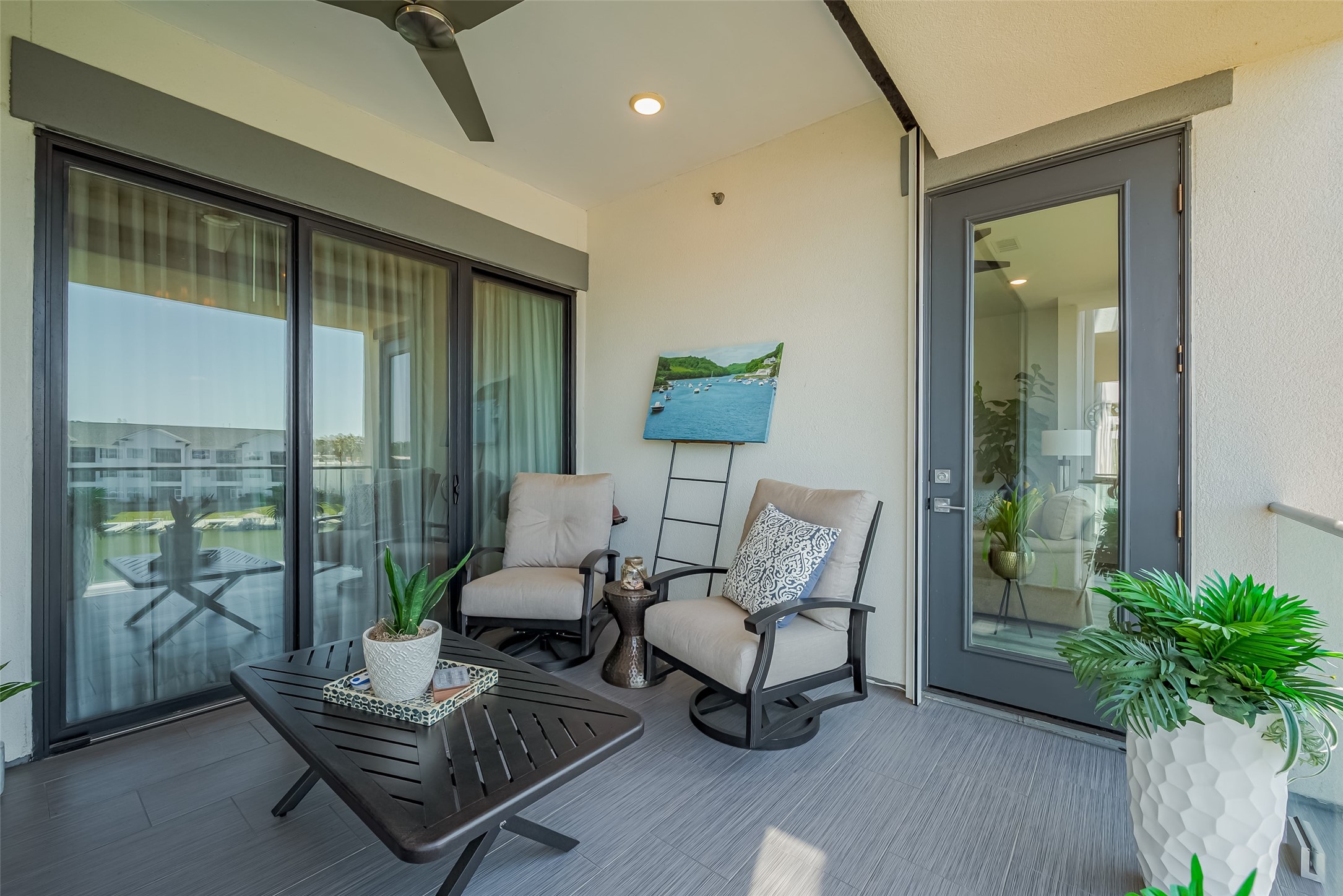 199 Waterpoint Court, Unit 302 Conroe, TX 77356 - Photo 16 of 20 Sip your morning coffee or toast to the sunset on this spacious private balcony, overlooking the glistening waters of Lake Conroe.