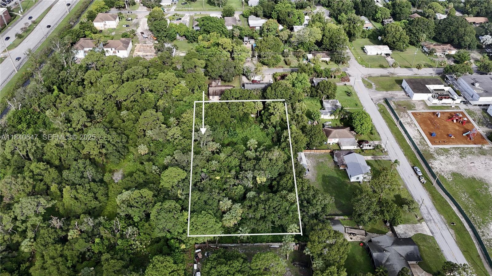 1 Tennessee Avenue Fort Pierce, FL 34947 - Photo 1 of 17 an aerial view of residential houses with outdoor space