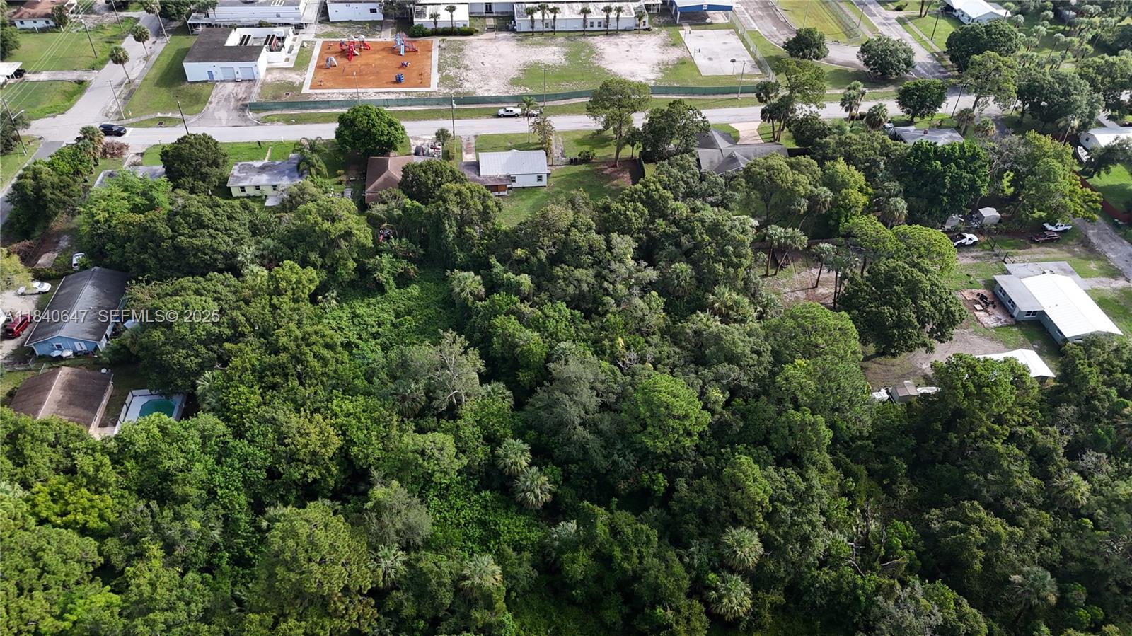 1 Tennessee Avenue Fort Pierce, FL 34947 - Photo 11 of 17 an aerial view of residential houses with outdoor space and trees