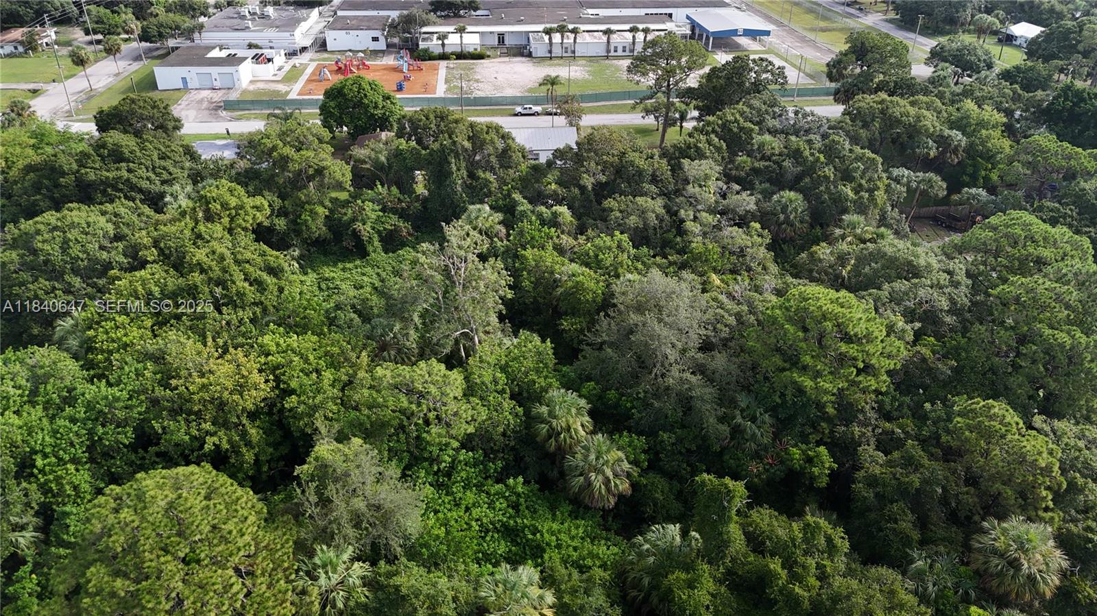 1 Tennessee Avenue Fort Pierce, FL 34947 - Photo 13 of 17 an aerial view of residential houses with outdoor space and trees