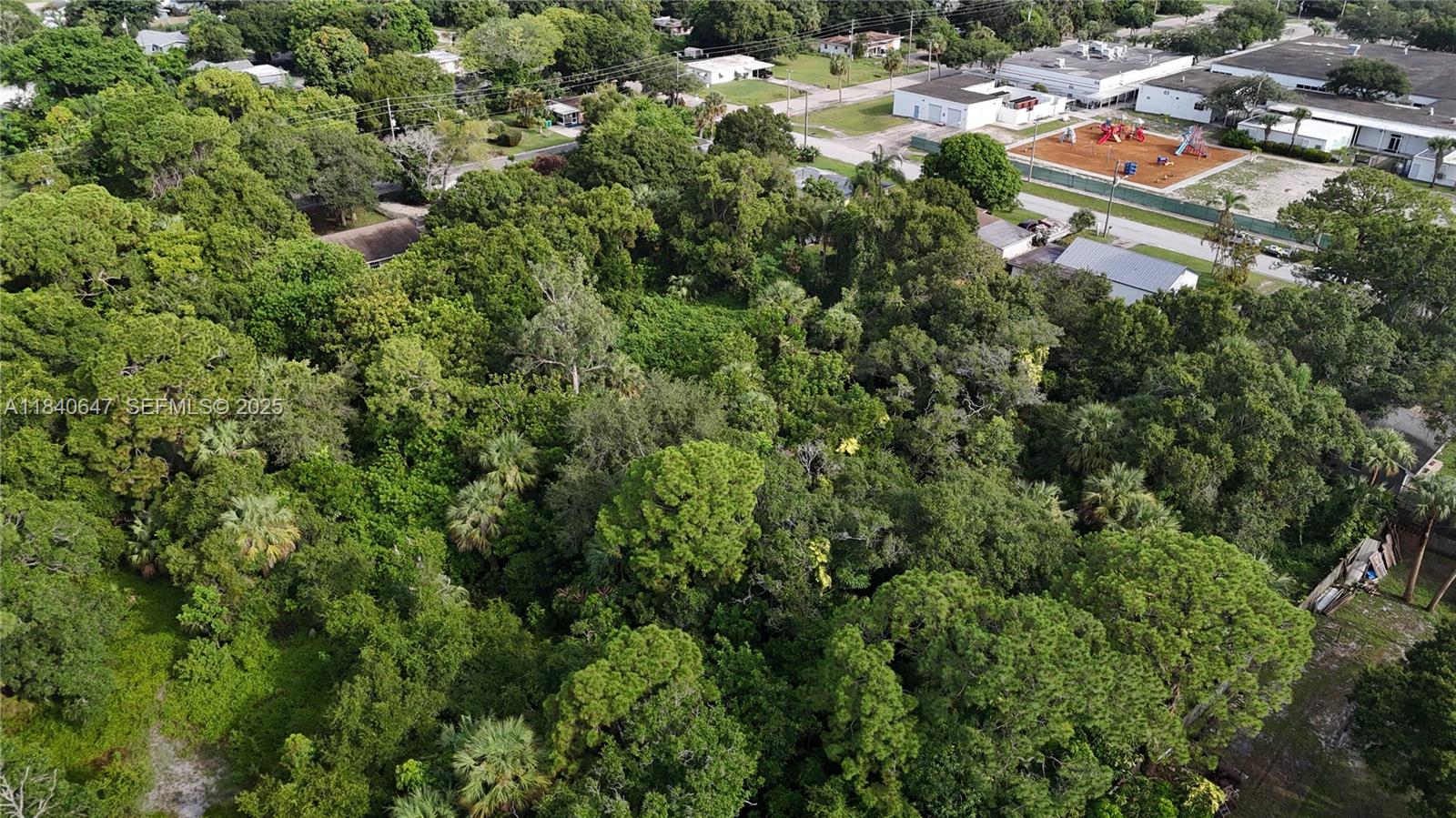 1 Tennessee Avenue Fort Pierce, FL 34947 - Photo 14 of 17 an aerial view of residential house with parking and yard