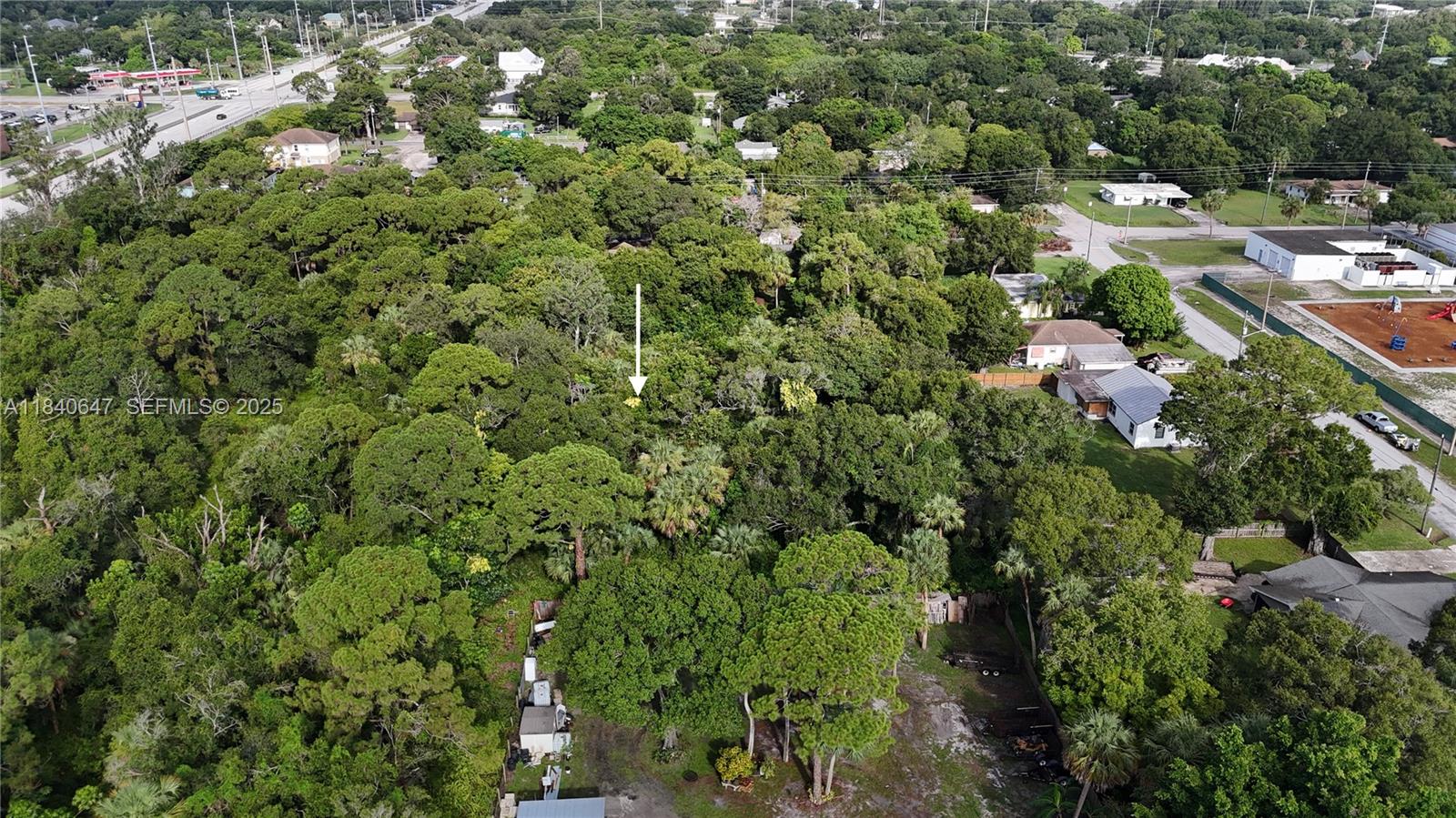 1 Tennessee Avenue Fort Pierce, FL 34947 - Photo 17 of 17 an aerial view of residential houses with outdoor space and trees