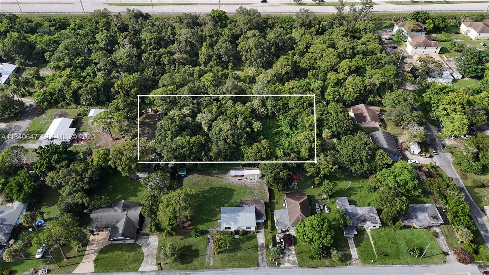 1 Tennessee Avenue Fort Pierce, FL 34947 - Photo 4 of 17 an aerial view of houses covered with trees