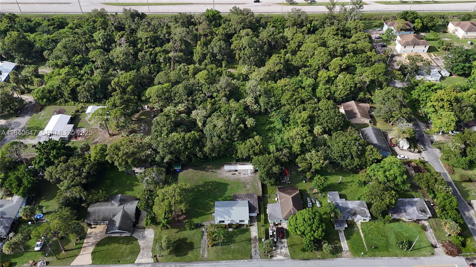 1 Tennessee Avenue Fort Pierce, FL 34947 - Photo 6 of 17 an aerial view of a house with a yard