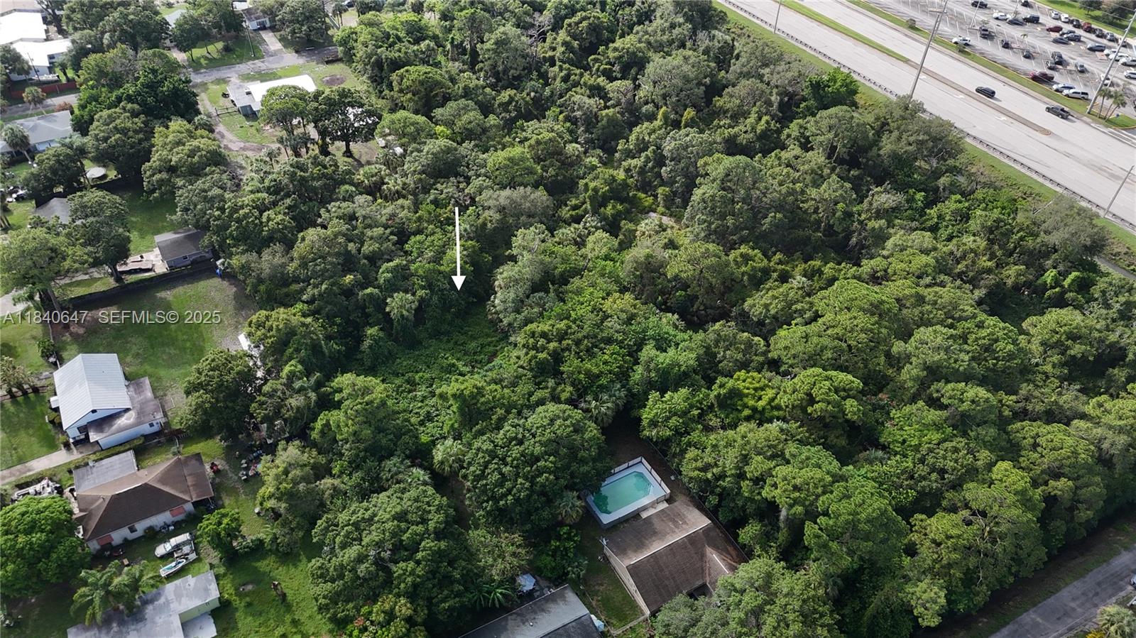 1 Tennessee Avenue Fort Pierce, FL 34947 - Photo 7 of 17 an outdoor space with lots of trees