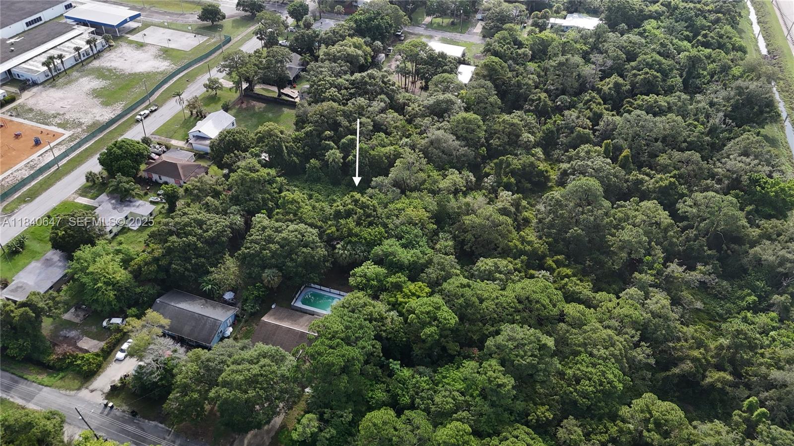 1 Tennessee Avenue Fort Pierce, FL 34947 - Photo 10 of 17 an aerial view of a house with a yard and outdoor seating