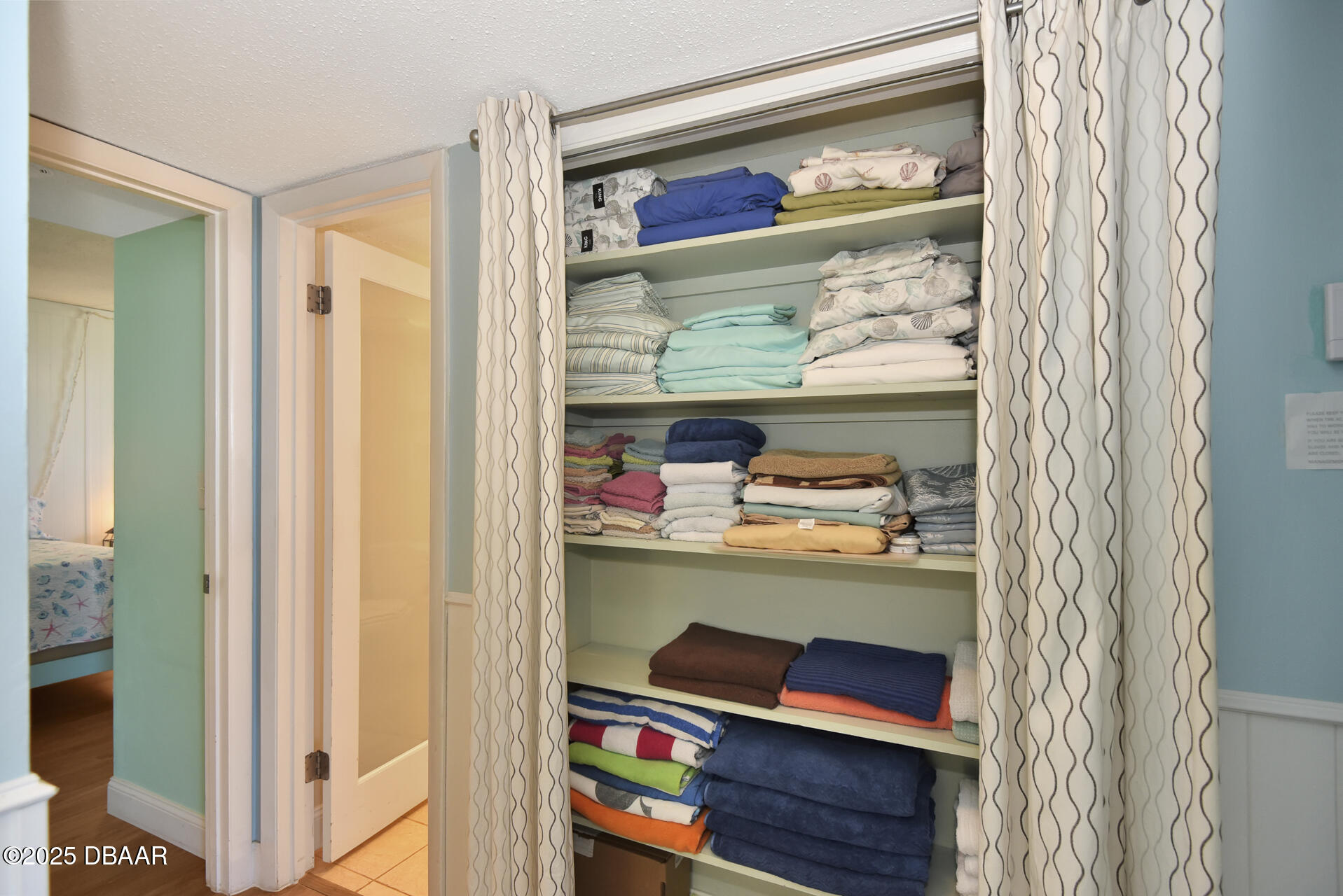 4495 South Atlantic Avenue, Unit 4040 Ponce Inlet, FL 32127 - Photo 17 of 45 a room with a walk in closet and a window