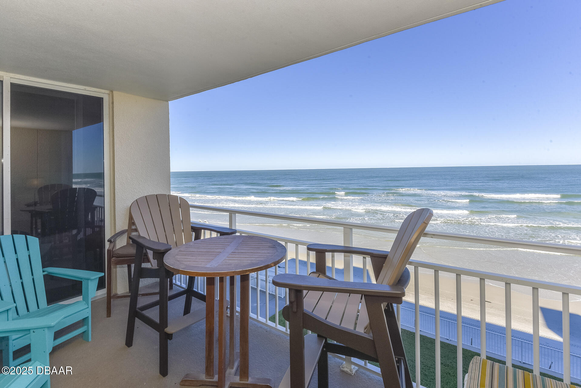 4495 South Atlantic Avenue, Unit 4040 Ponce Inlet, FL 32127 - Photo 2 of 45 a view of a dining room with furniture window and wooden floor