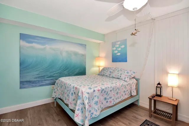 a bathroom with a shower curtain and a toilet