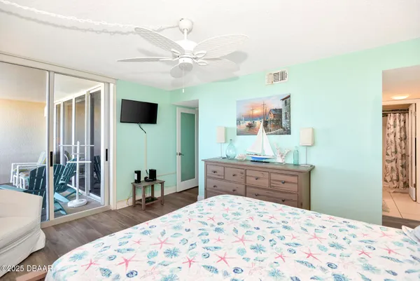 a bedroom with a bed and a dresser