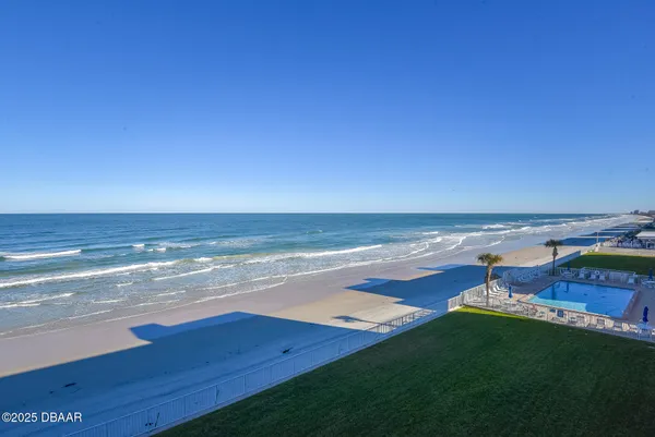 a view of an ocean with a beach