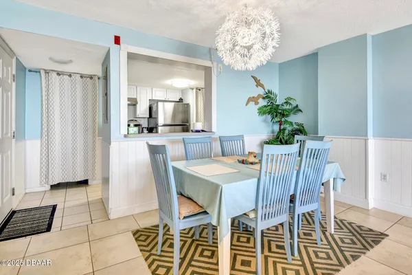 a dining room with furniture and window
