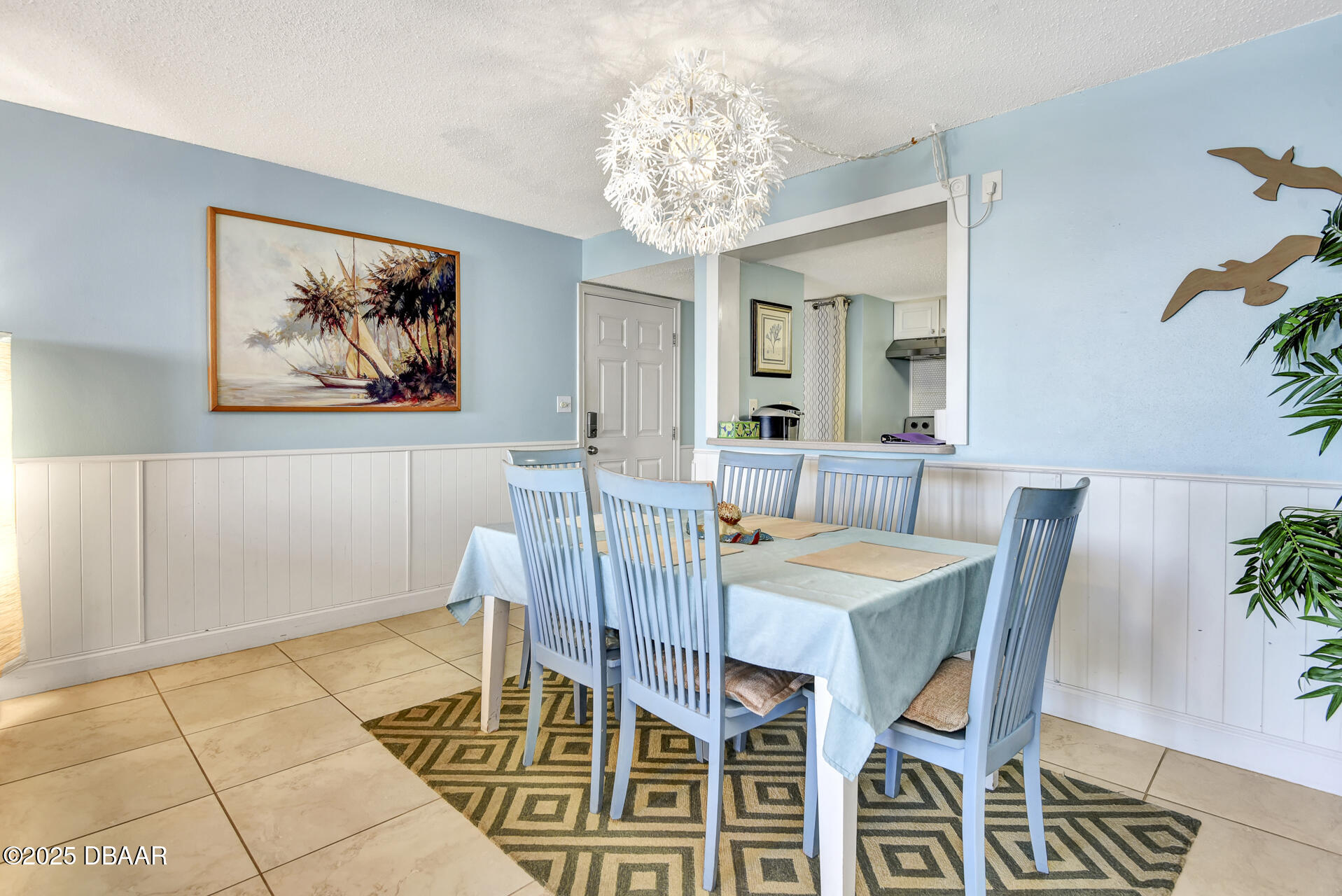 4495 South Atlantic Avenue, Unit 4040 Ponce Inlet, FL 32127 - Photo 9 of 45 a view of a dining room with furniture and chandelier