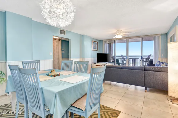 a kitchen with a table and chairs in it