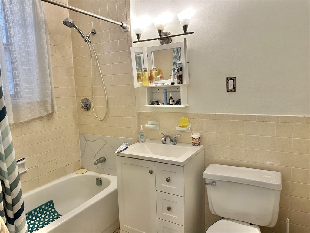 464 Commonwealth Avenue, Unit 38 Boston, MA 02215 - Photo 11 of 16 a bathroom with a sink toilet and shower