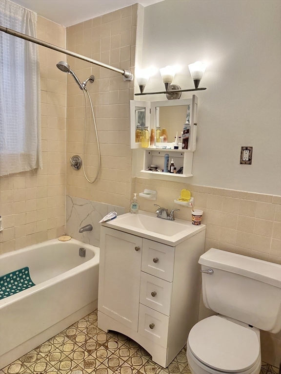 464 Commonwealth Avenue, Unit 38 Boston, MA 02215 - Photo 12 of 16 a bathroom with a sink a toilet and shower