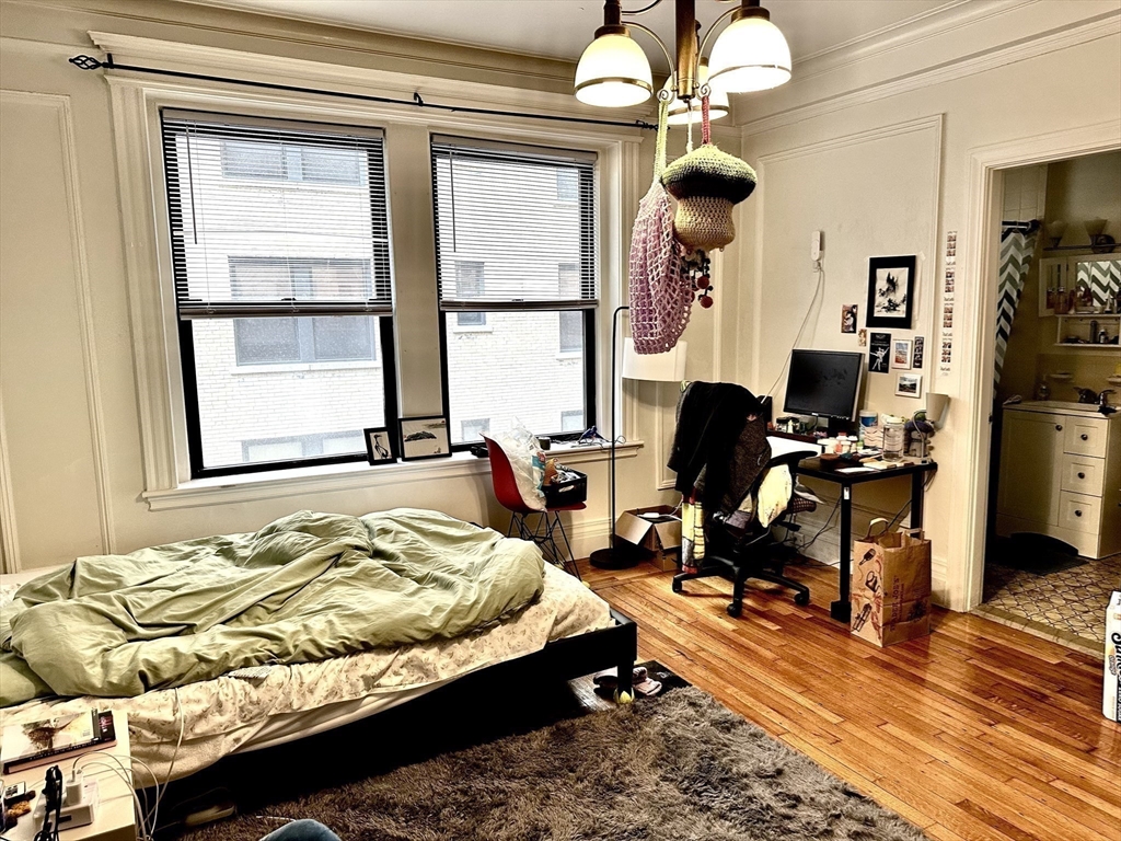 464 Commonwealth Avenue, Unit 38 Boston, MA 02215 - Photo 6 of 16 a bedroom with bed and window