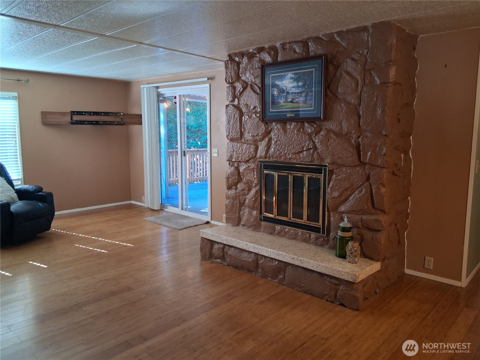 815 124th Street Southwest, Unit 36 Everett, WA 98204 - Photo 15 of 33 a living room with hard wood floors and a fireplace