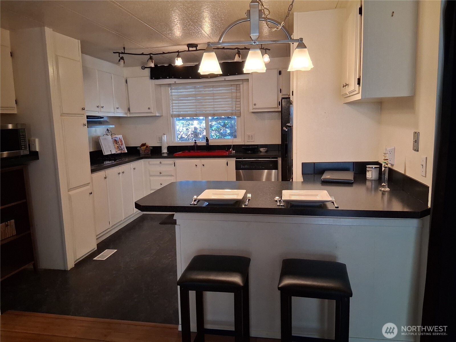 815 124th Street Southwest, Unit 36 Everett, WA 98204 - Photo 19 of 33 a kitchen with stainless steel appliances a sink and cabinets