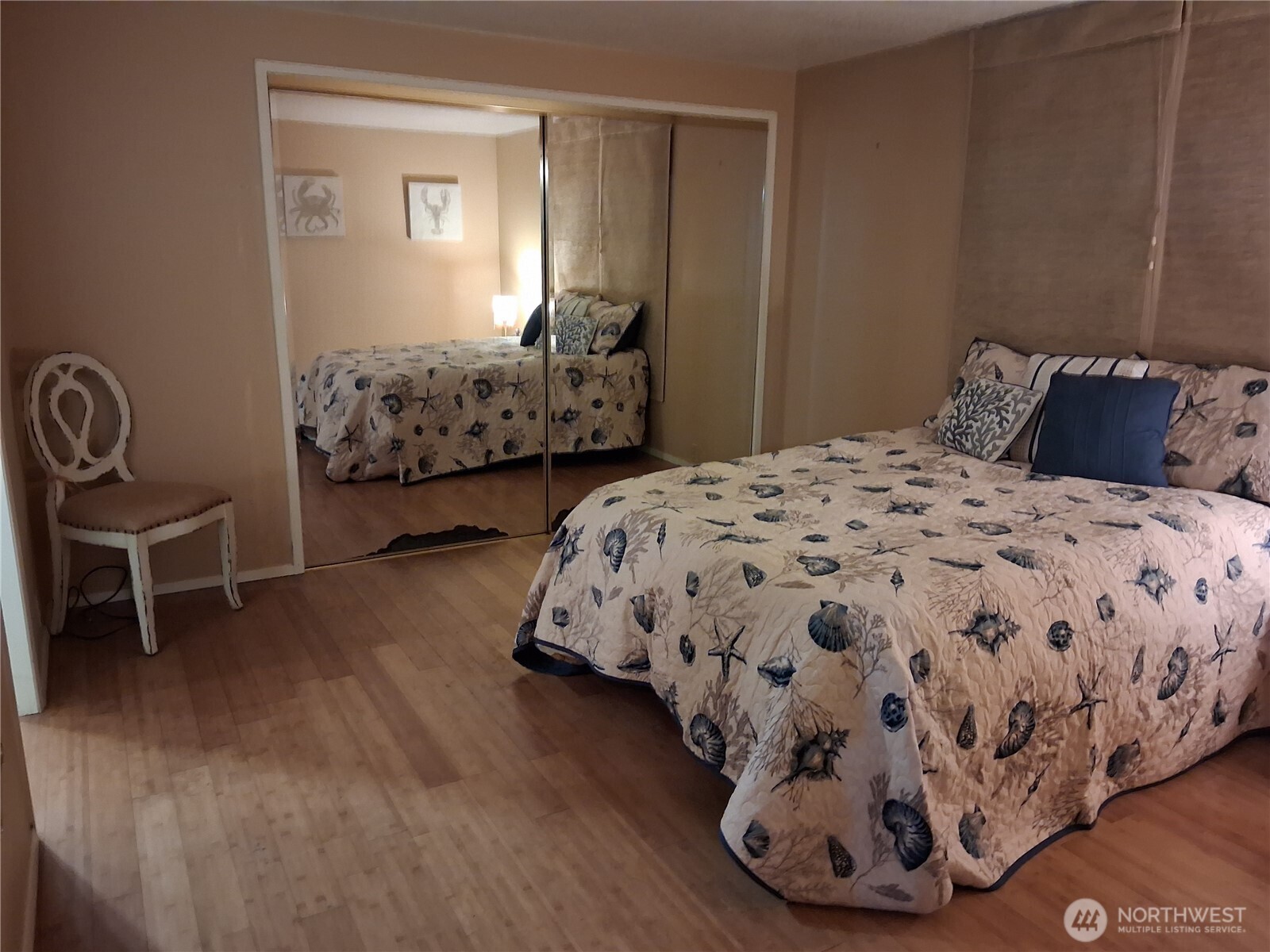 815 124th Street Southwest, Unit 36 Everett, WA 98204 - Photo 24 of 33 a bedroom with a bed and a chair