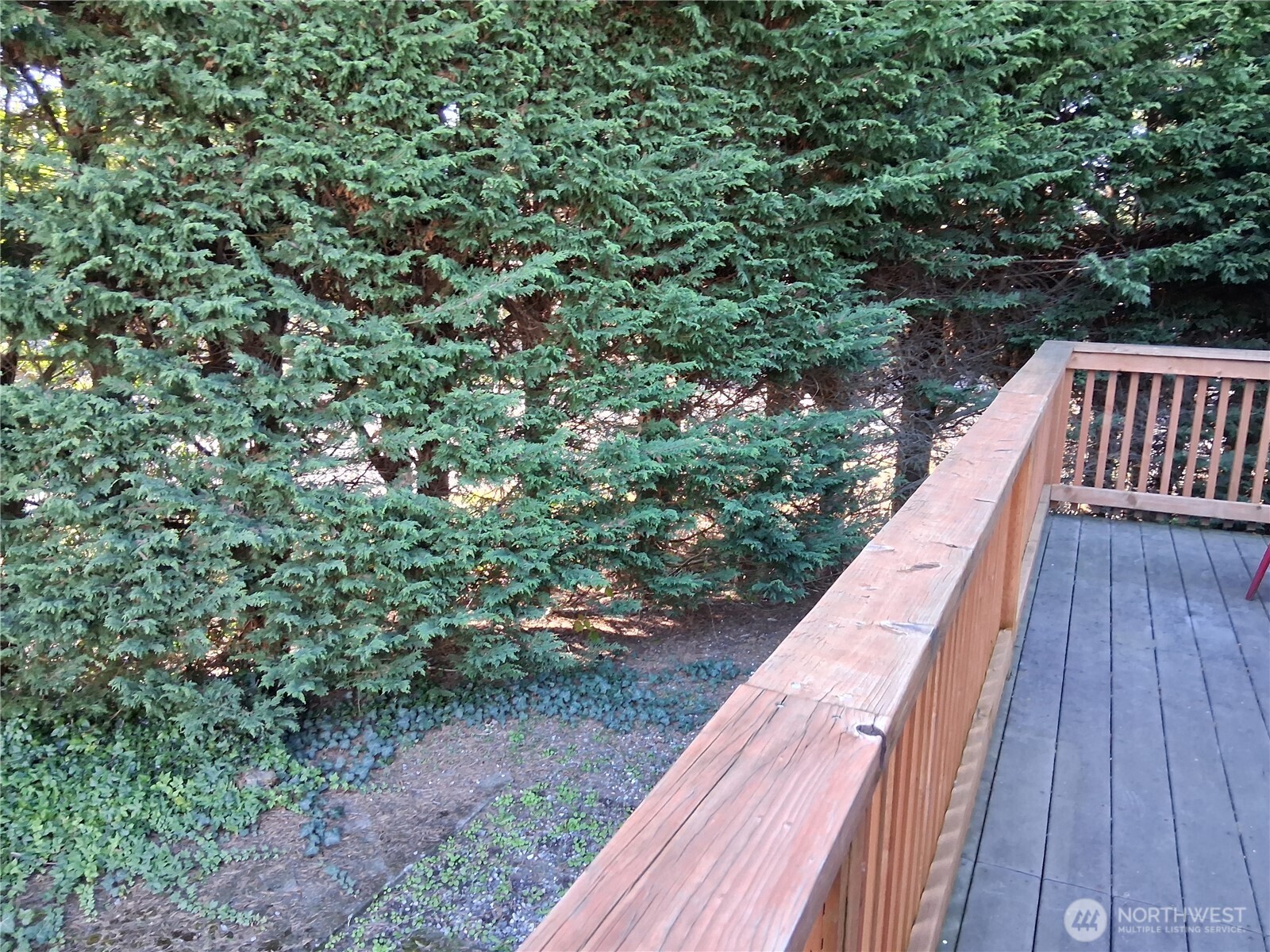 815 124th Street Southwest, Unit 36 Everett, WA 98204 - Photo 29 of 33 a view of balcony with wooden floor and fence