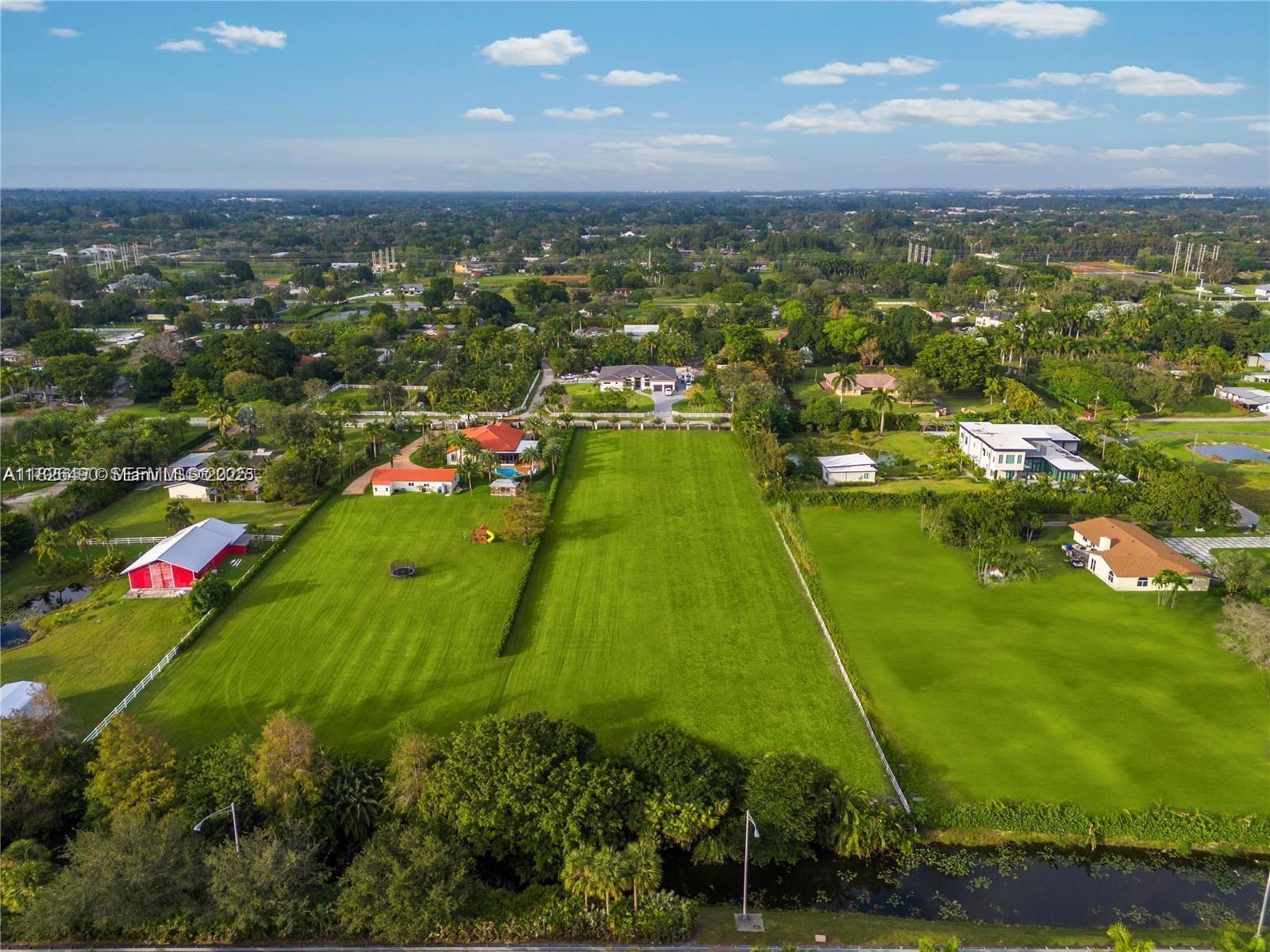 70 Southwest Pl Ranches Southwest Ranches, FL 33331 - Photo 7 of 15 an aerial view of residential houses with outdoor space
