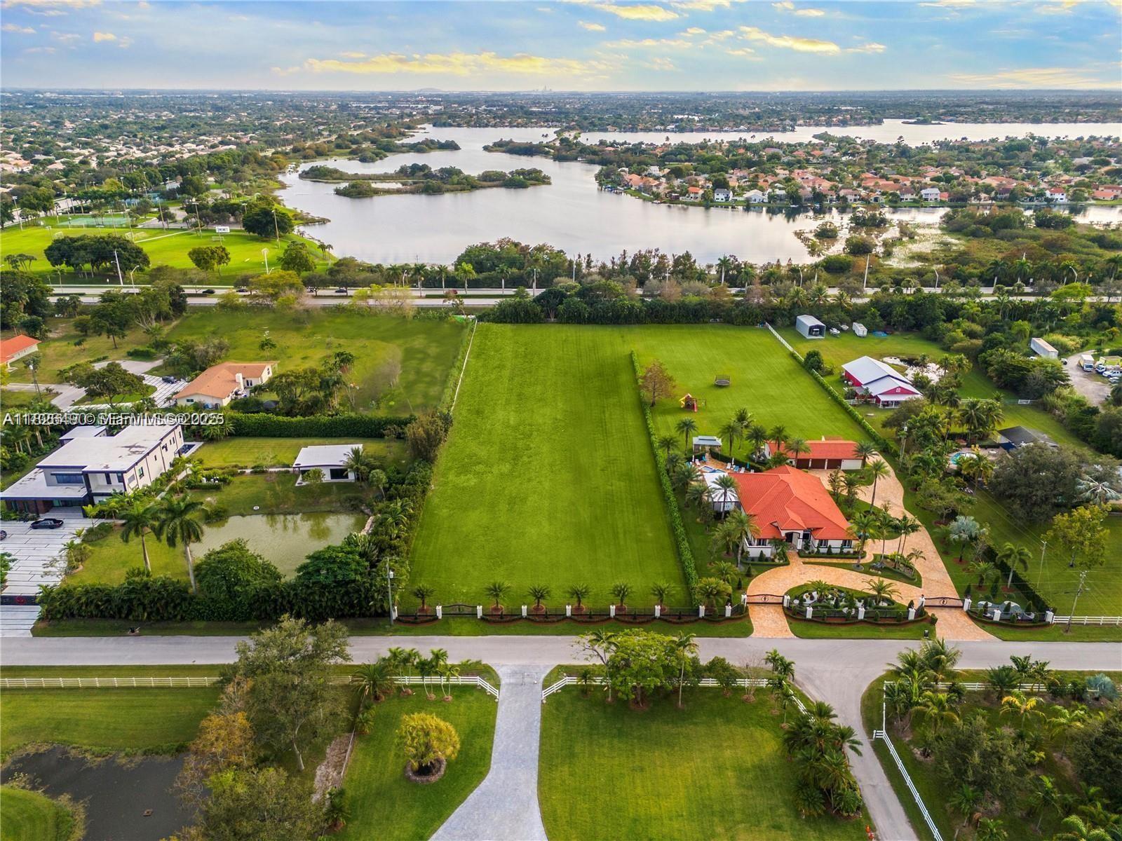 70 Southwest Pl Ranches Southwest Ranches, FL 33331 - Photo 8 of 15 an aerial view of residential houses with outdoor space and swimming pool