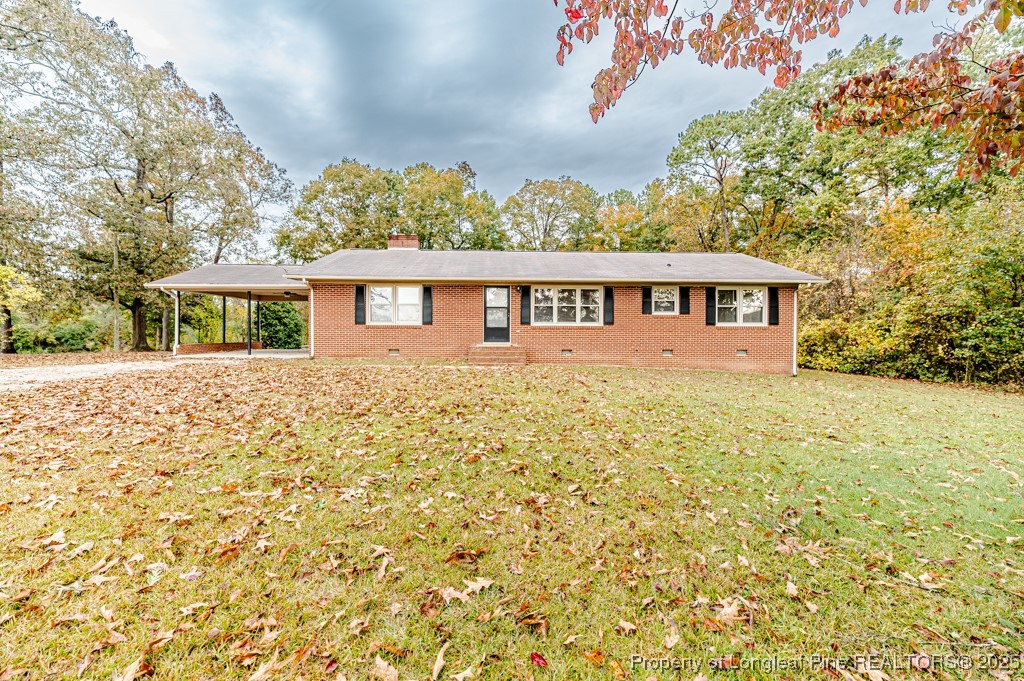 406 McFarland Road Broadway, NC 27505 - Photo 1 of 37 a view of front of house with a yard
