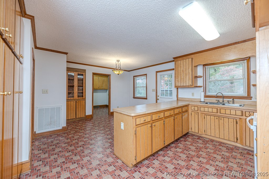 406 McFarland Road Broadway, NC 27505 - Photo 15 of 37 a kitchen with stainless steel appliances granite countertop a refrigerator and a sink