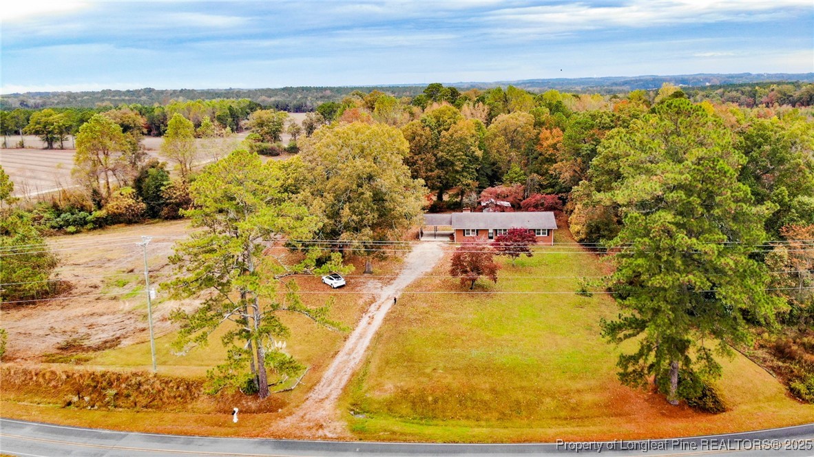 406 McFarland Road Broadway, NC 27505 - Photo 2 of 37 a view of a swimming pool