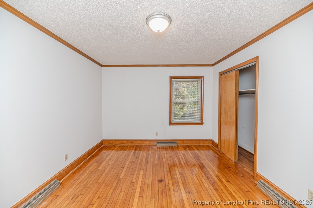 406 McFarland Road Broadway, NC 27505 - Photo 28 of 37 a view of a room with wooden floor and window