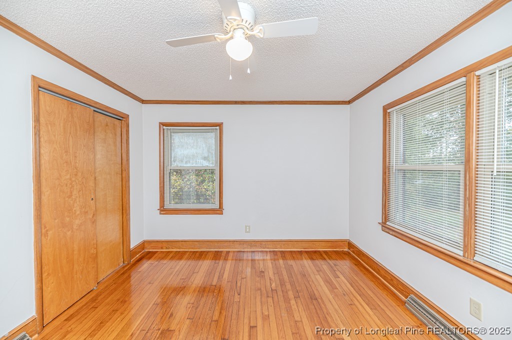 406 McFarland Road Broadway, NC 27505 - Photo 29 of 37 a view of an empty room with wooden floor and a window
