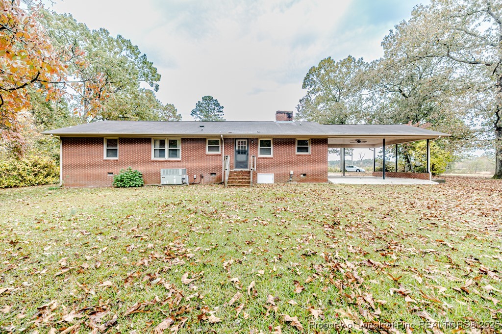 406 McFarland Road Broadway, NC 27505 - Photo 34 of 37 front view of a house with a yard