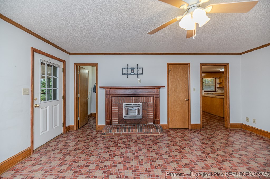 406 McFarland Road Broadway, NC 27505 - Photo 9 of 37 an empty room with fan and windows