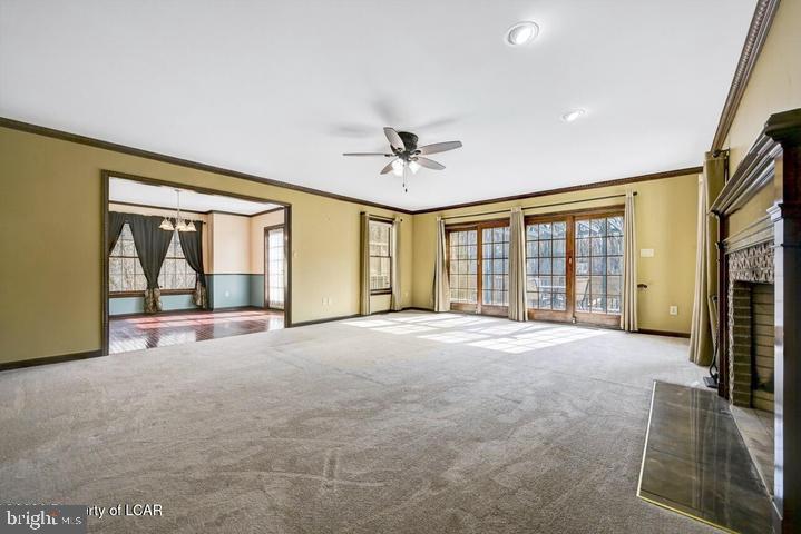 1424 East Broad Street Hazleton, PA 18201 - Photo 13 of 89 a view of an empty room with a fireplace and a large window