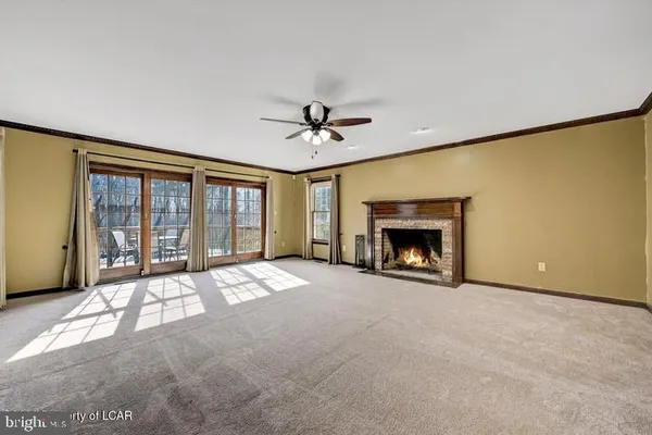 a large kitchen with a large counter space cabinets and appliances