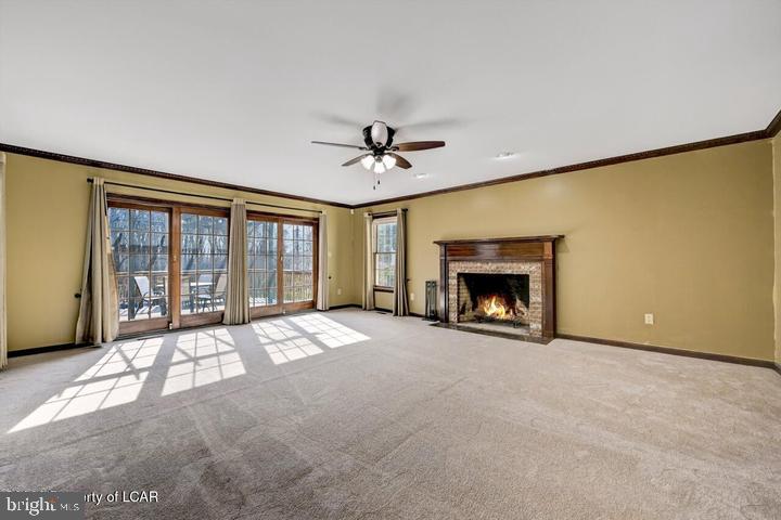 1424 East Broad Street Hazleton, PA 18201 - Photo 14 of 89 a view of an empty room with a fireplace and a window