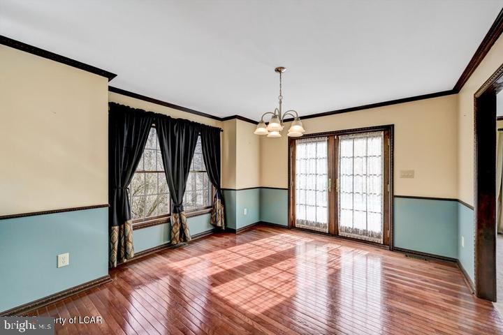1424 East Broad Street Hazleton, PA 18201 - Photo 15 of 89 a view of empty room with wooden floor and fan