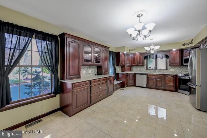 1424 East Broad Street Hazleton, PA 18201 - Photo 21 of 89 a large kitchen with a large counter space cabinets and appliances